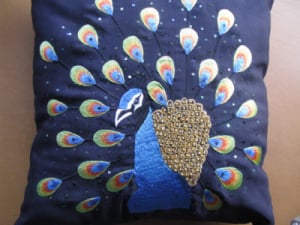 Peacock embroidered cushion